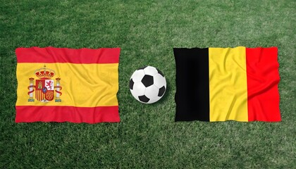 Fototapeta premium Spain and belgium national flags waving with a soccer ball on a green grass field
