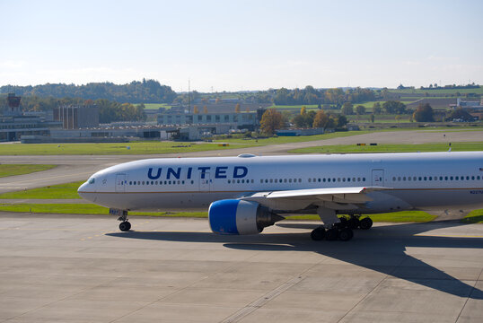 Untied Airlines passenger airplane type Boeing 777-200 registration N227UA leaving Swiss Z&uuml;rich Airport on a sunny autumn day. Photo taken October 18th, 2025, Zurich Airport, Switzerland.