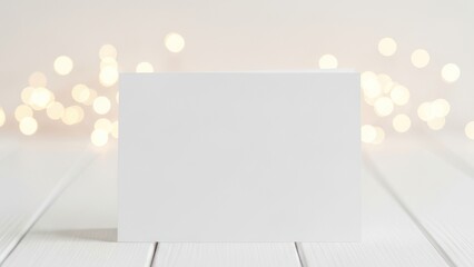 Fototapeta premium Blank White Greeting Card on Bokeh Background
