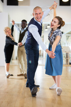Adult dancing couple enjoying active swing