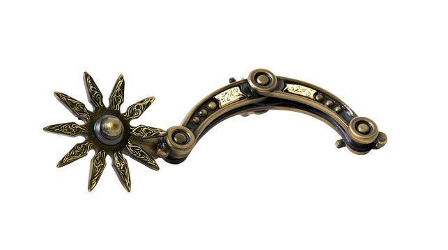 Ornate antique metal cowboy spur with star-shaped rowel, isolated on transparent background