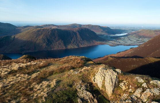 Views over Crummock Water to the summit of Mellbreak early on a winters morning in Cumbria, Lake District, England UK.