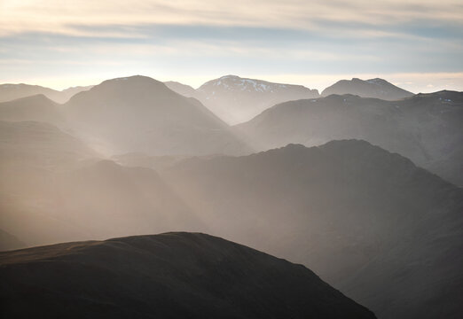 Views from Grasmoor towards Whiteless Pike in the foreground and Fleetwith Pike, Haystacks and Great Gable early on a winters morning in Cumbria, Lake District, England UK.
