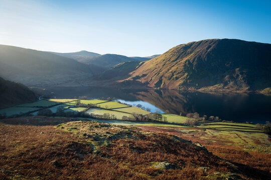 Views across Rannerdale, Crummock Water with the summit of Mellbreak in the distance in the Lake District on a sunny winters morning in Cumbria, England UK.