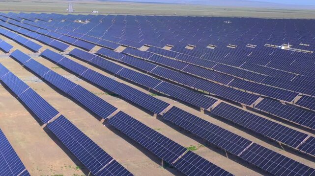 Drone aerial shot of photovoltaic array farm on vast Gobi land, clean solar power infrastructure，new energy, solar energy