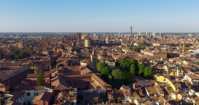 Historic Skyline Of Bologna Filled With Iconic Terracotta-Tiled Rooftops And Towers In Italy. - aerial shot