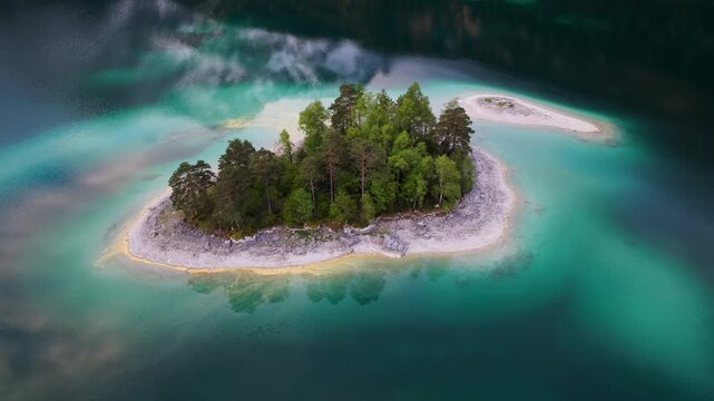 Island Within Lake Eibsee With Turquoise Waters In Bavaria, Germany. - aerial shot
