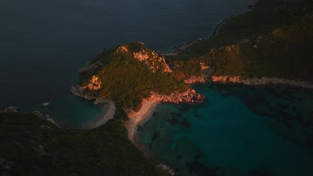 Drone shot of Porto Timoni double beach in Corfu during golden hour sunset