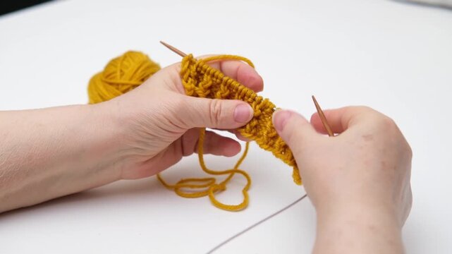 female hands knitting close up