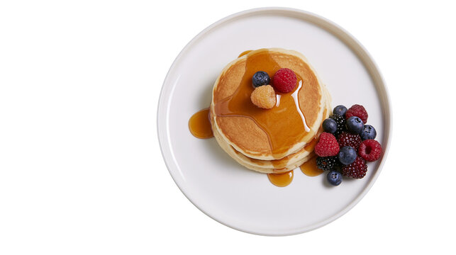 Stack of golden pancakes with fresh berries and maple syrup, isolated on transparent background