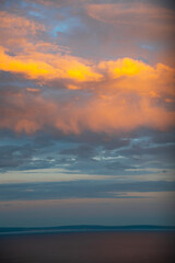 Fototapeta premium Golden sunset clouds after storm over the Adriatic Sea with peaceful horizon