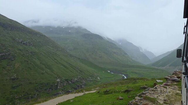 Scenic Road Journey Through Green Mountain Landscapes