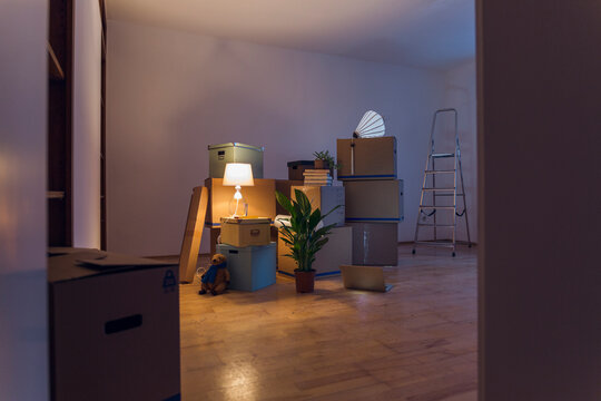 Cardboard boxes in an empty room in a new home