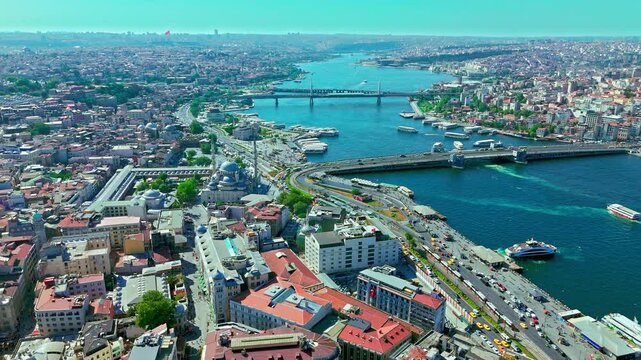 Aerial view of the Golden Horn in Istanbul, Turkey. Galata Bridge, boats, waterfront roads and dense city districts show the historic waterway between Fatih and Galata.