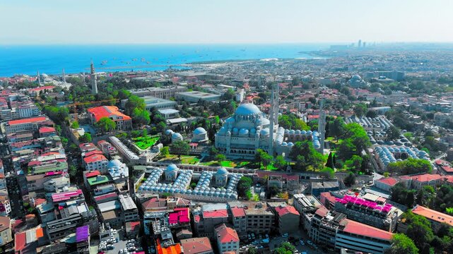 Aerial footage of Suleymaniye Mosque set among the historic buildings of Istanbul. The scene presents a broad urban panorama with the mosque as the main focal point.