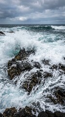 Fototapeta premium dynamic close up shot ocean waves washing over coastal rocks