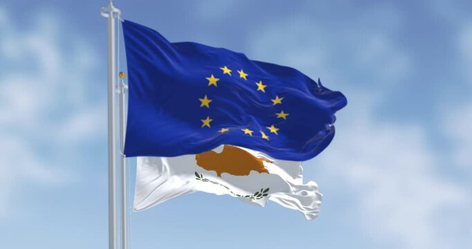 Cyprus national flag waving with the European Union flag on a clear day