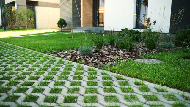 Green lawn pavement creating an eco-friendly modern garden landscape design at a residential house