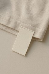 Fototapeta premium Minimalist beige fabric tag detail.