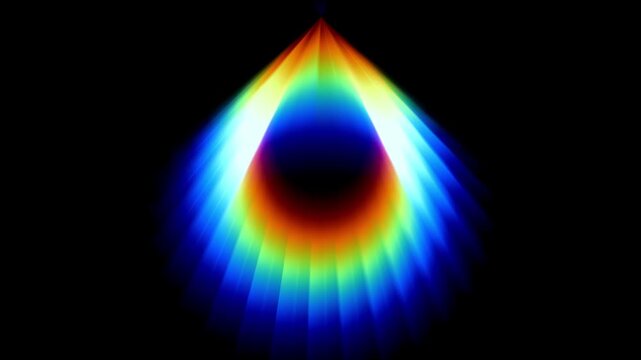 Rainbow colored teardrop or flame shaped glow pointing upward with a bright blue tip against a black background surface with a smooth glowing today