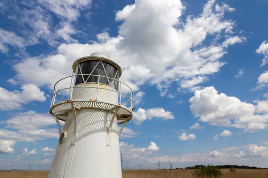 Low angle view of East Usk Lighthouse under a blue sky in Newport Wales