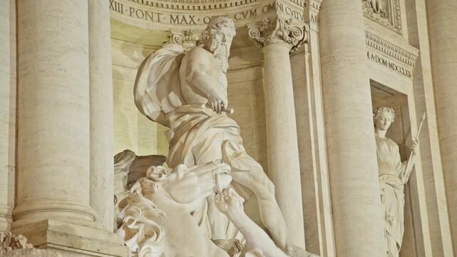 Close-up view of the magnificent marble sculpture of oceanus on the famous trevi fountain in rome, italy. Iconic masterpiece of baroque art