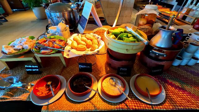 Colorful buffet table with assorted dishes at Dusit Thani Mactan Cebu, Philippines.