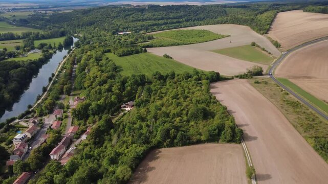 Aerial panorama of Saint Mihiel town and surrounding rural landscape with fields, forests, and the Meuse River in France