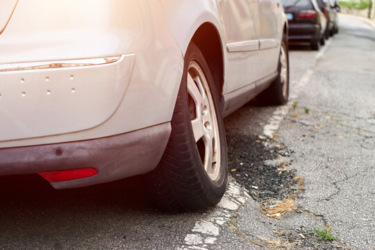 Car maintenance warning shown by damaged suspension and tire angle