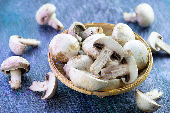 White Champignon mushroom in wooden basket, Fresh Champignon mushroom High-quality culinary ingredient organic food marketing, gourmet recipes, plant-based diet concepts, and healthy food packaging.