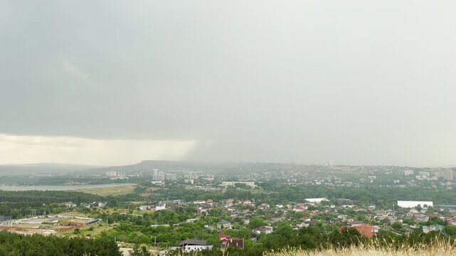 A gloomy summer shower sweeps over the peaceful city of Simferopol, Crimea. The dramatic sky feels both refreshing and melancholic.