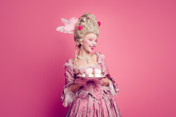 Fototapeta premium Photo of charming positive marie antoinette wear rich dress ready eat desserts empty space isolated pink color background