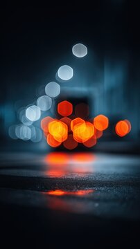 Defocused bokeh lights on wet city street at night, abstract urban background