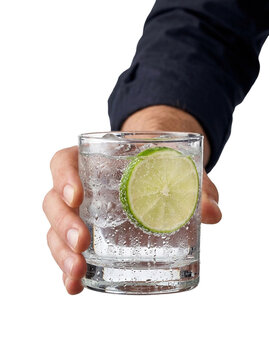 Hand holding a gin and tonic with lime, transparent background
