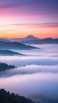 Majestic Mount Fuji pierces through a sea of clouds at dawn, illuminated by a soft, pastel sky.