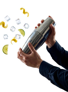 Bartender hands shaking cocktail shaker with flying ingredients, transparent background