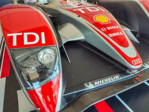 Le Mans, France - July 03, 2026: Audi TDI race car front view in paddock at Le Mans Classic event showcasing detailed design and branding elements