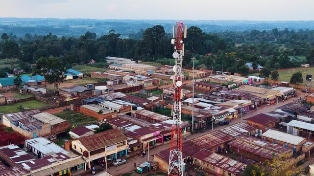 Drone aerial footage rural slum informal settlement rural Africa village telecommunication cell tower in Africa kenya south Africa