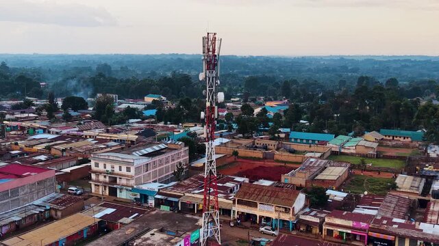 Drone aerial footage rural slum informal settlement rural Africa village telecommunication cell tower in Africa kenya south Africa
