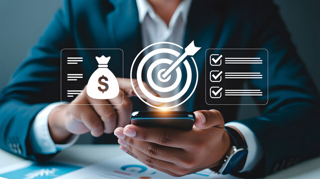 Business person using a smartphone with digital icons for financial goals and task management