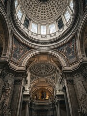 Obraz premium Grand interior view of the Pantheon in Paris featuring classical dome architecture and historical frescoes