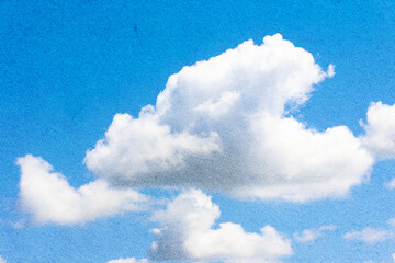 Obraz premium Single cloud isolated over blue sky background. White fluffy cloud photo, beautiful cloud shape. Climate concept