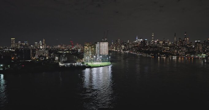 NYC New York Aerial v273 cinematic drone flyover Astoria Queens capturing illuminated cityscape of Upper East Side Manhattan across East river at night - Shot with Inspire 3 8k - September 2023