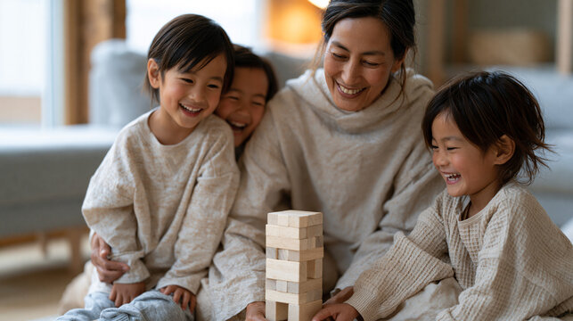 Filipino grandmother on a living room floor building a block tower with two small grandchildren, all three laughing as it topples, grandparent babysitting concept, natural morning