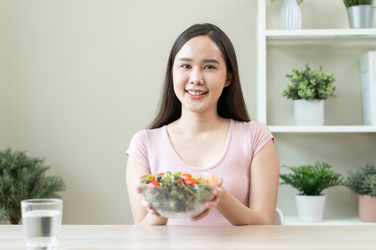 Happy wellness meal, Woman eats salad as lunch and controls calories for the meal for her body care