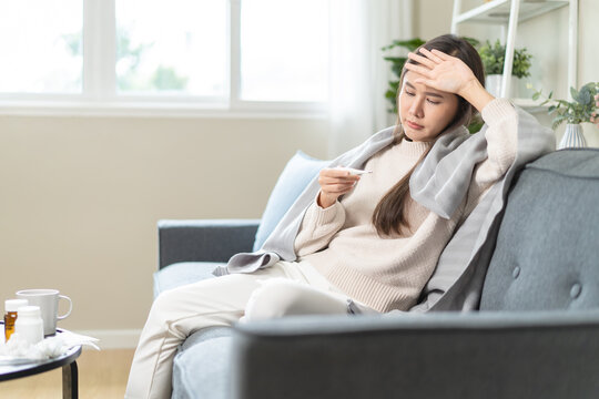 Women have a fever and a sore throat, and feel sick and cold.