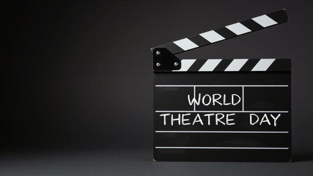 World Theatre Day Clapperboard Against Dark Background  