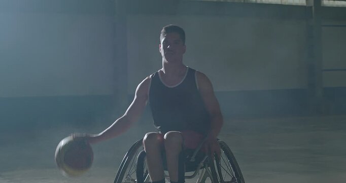 Detailed view of a wheelchair basketball player bouncing the ball while maneuvering a sports wheelchair during indoor practice, showcasing adaptive mobility, precision, coordination, resilience, 