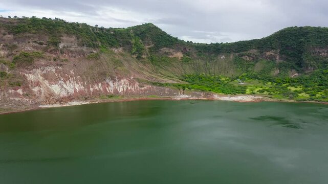 Green crater lake and Taal volcano, aerial view.The smallest Taal volcano in the Philippines. Travel vacation concept