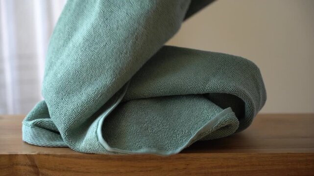 Macro close-up video of textured cotton terry towel fabric showing soft fibers and detailed weave structure